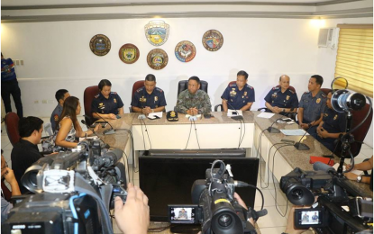 <p>PROBE. Calabarzon Police Regional Director Chief Supt. Edward Carranza (center) presides over a press conference late afternoon on Tuesday (July 3). He said an ordinary marksman could be behind the killing of Tanauan City Mayor Antonio Halili as the line of sight of some 160 meters vantage point could not be considered a sniper’s work. <em>(Photo courtesy of PRO4A-RPIO)</em></p>